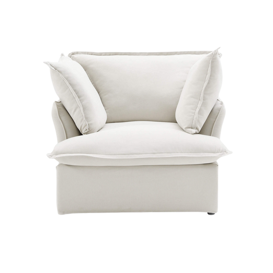 White armchair with cushions on a white background
