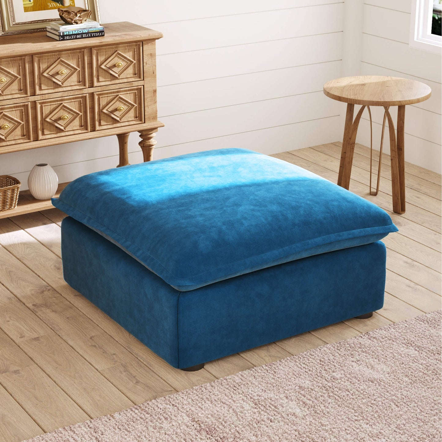 Blue ottoman in a room with wooden furniture and decor.