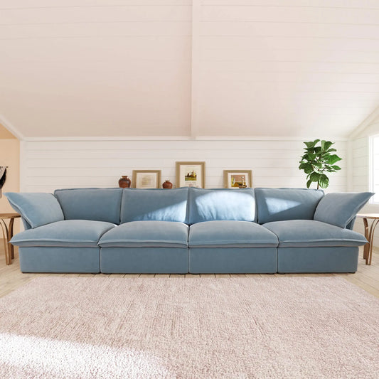 Light blue 4-seat sofa in a living room setting with a neutral color palette
