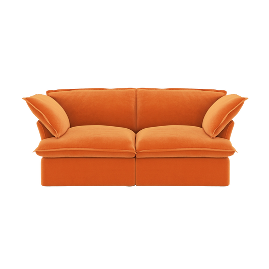 Orange sofa with curved armrests on a white background