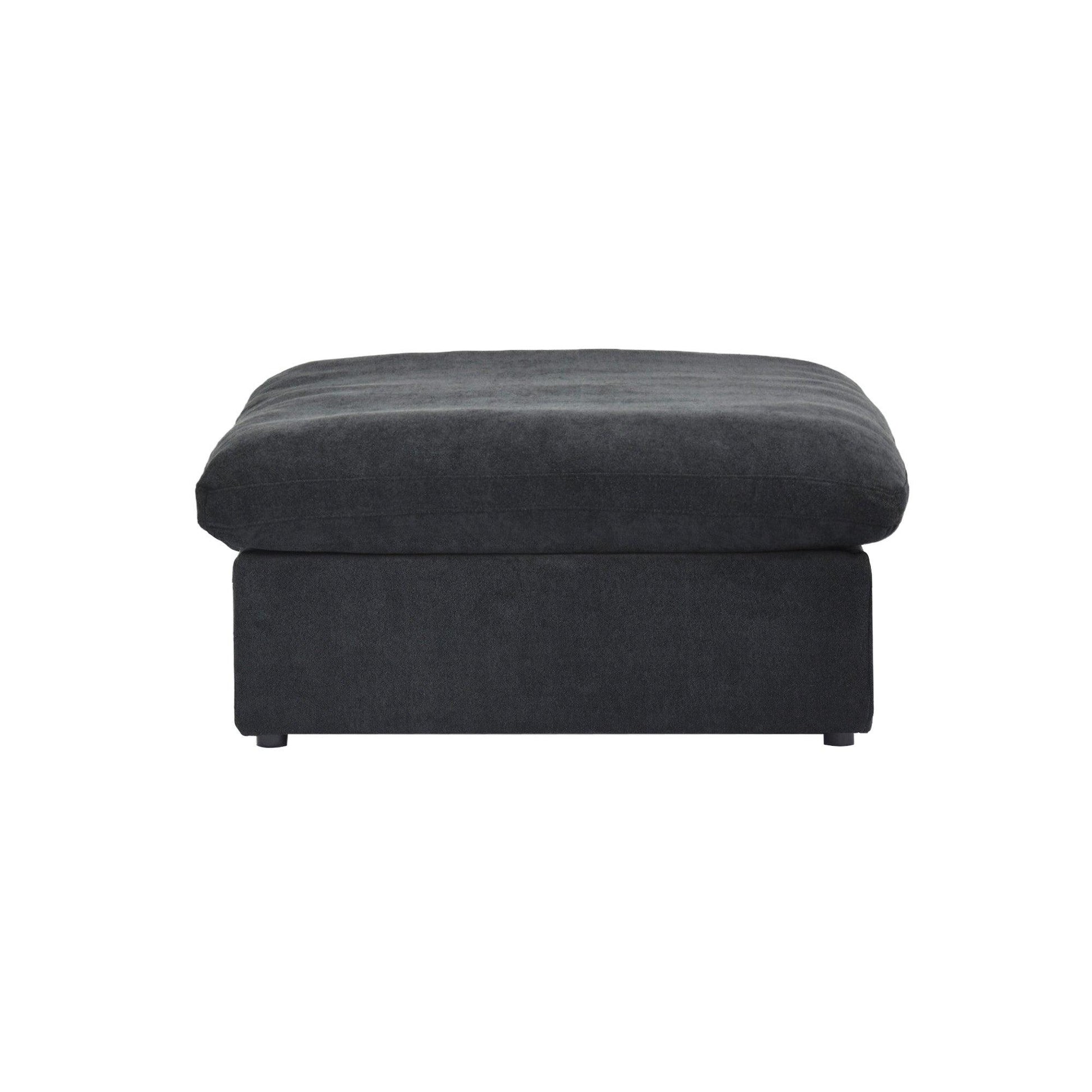 Black ottoman with a hidden storage on a white background