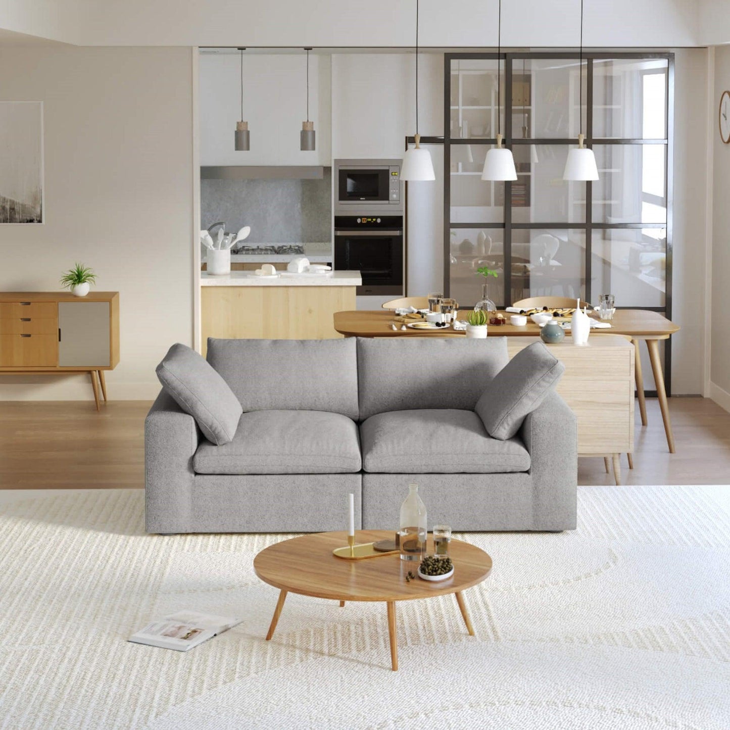 A modern gray loveseat sectional sofa in a bright living room setting, featuring a white slipcover, and designed for small space functionality.