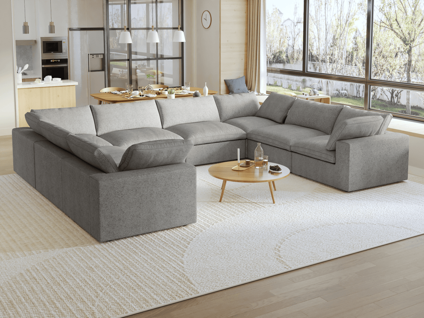 A modern, modular pit-style 8-seat sectional sofa in gray in a living room setting with white cushions and a clean, contemporary design.