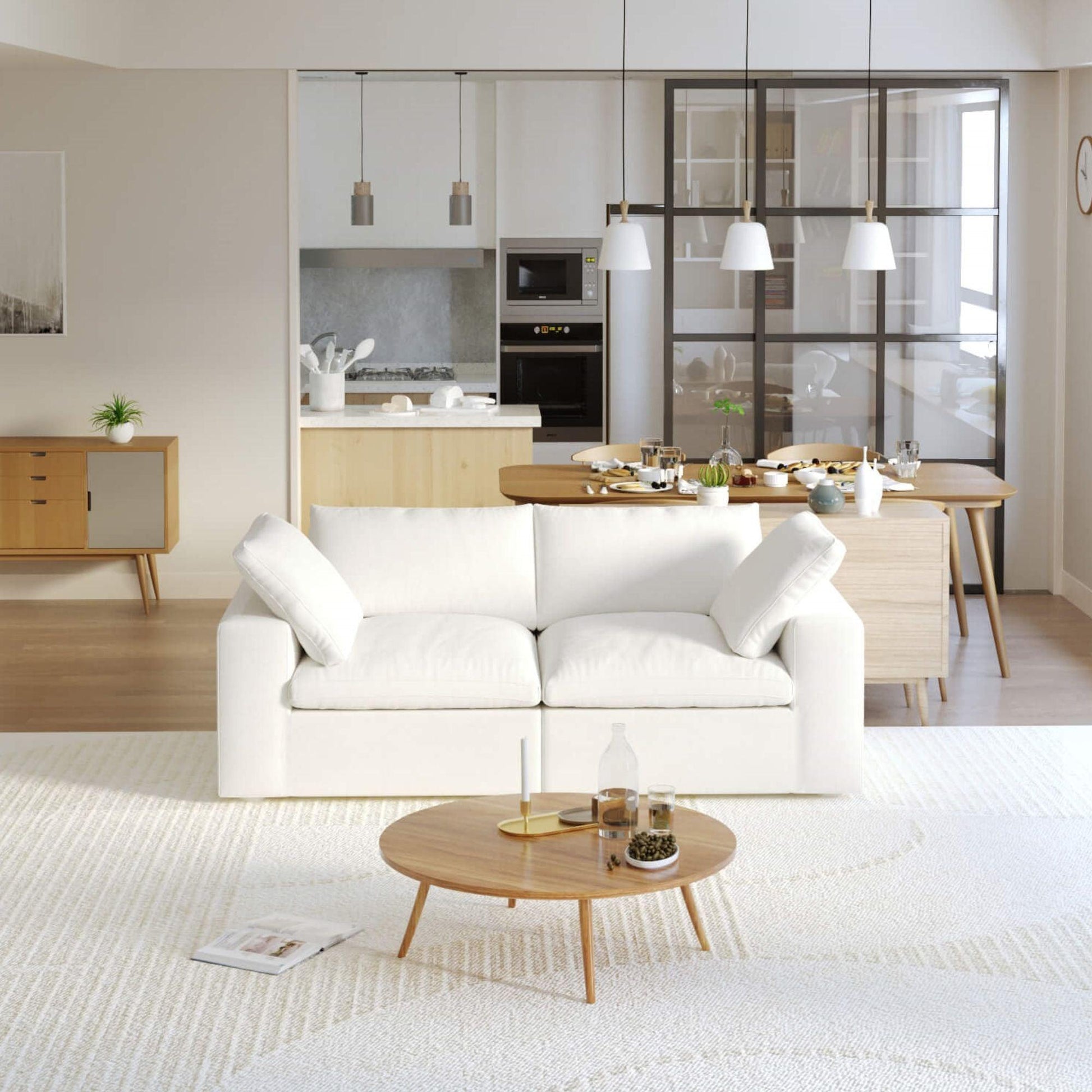 A modern loveseat sectional sofa in a bright living room setting, featuring a white slipcover, and designed for small space functionality.
