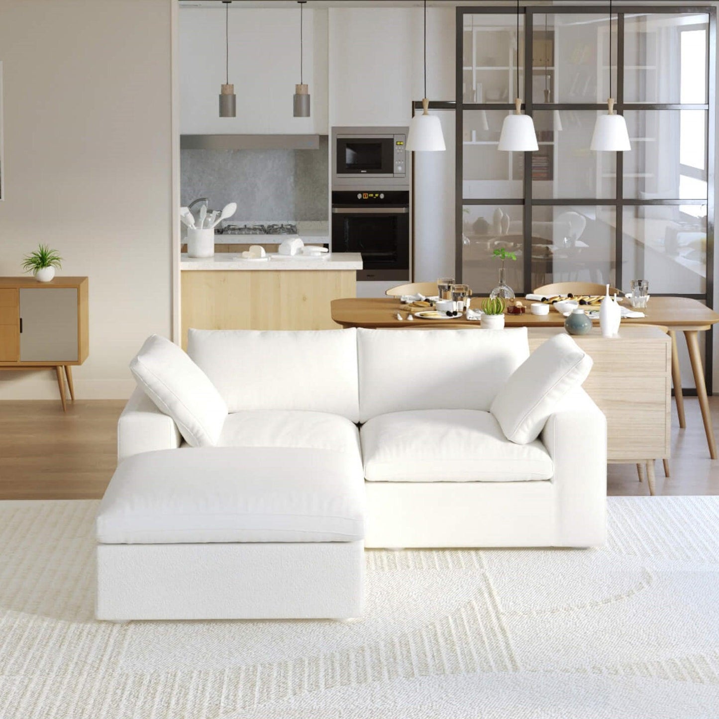A white modular sectional sofa with a storage ottoman in a modern living room setting.