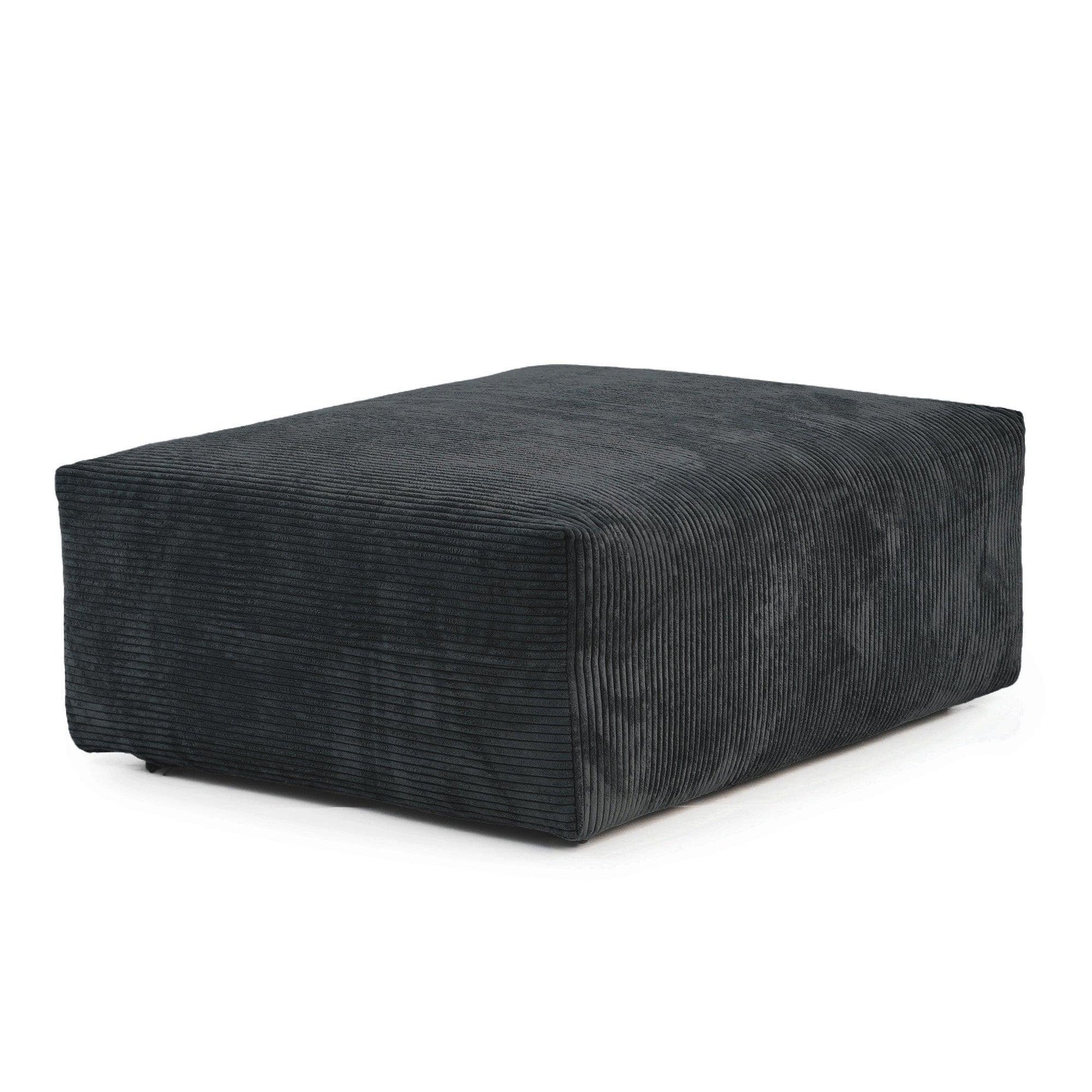 A black corduroy modular ottoman with removable covers, presented in a minimalist style against a white background.