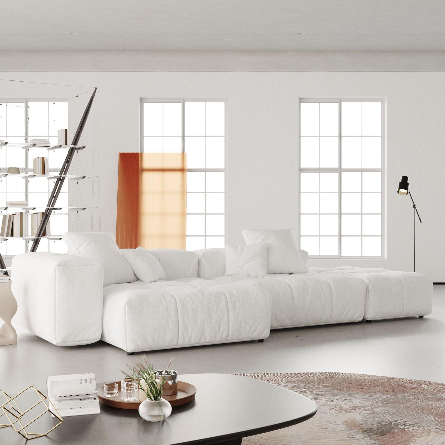 A modern, white modular 3-seat lounger sofa in a bright room, featuring a linen white upholstery with wide armrests and high-density foam cushions.