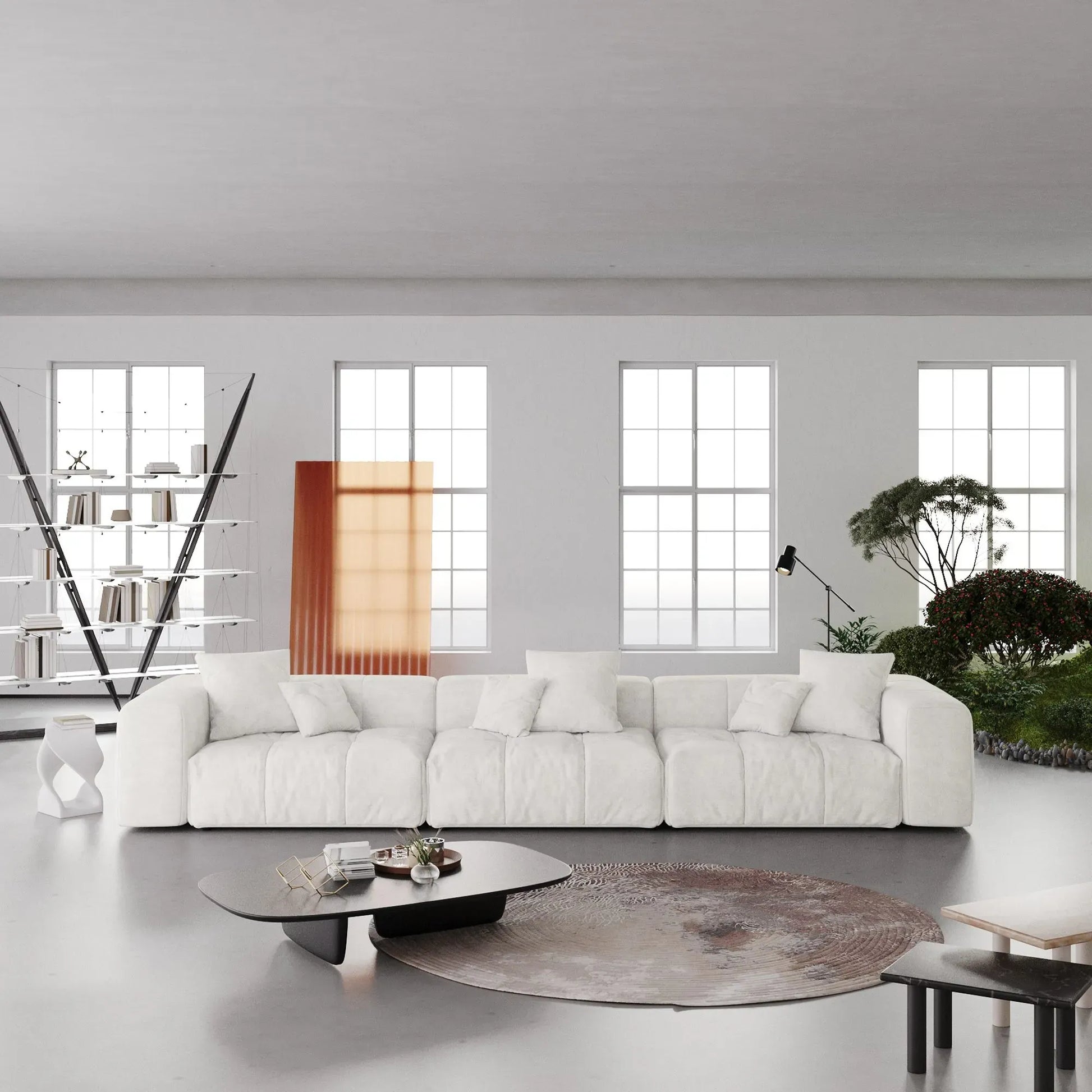 Modern living room with a white 3-seater sofa, coffee table, and decorative elements.