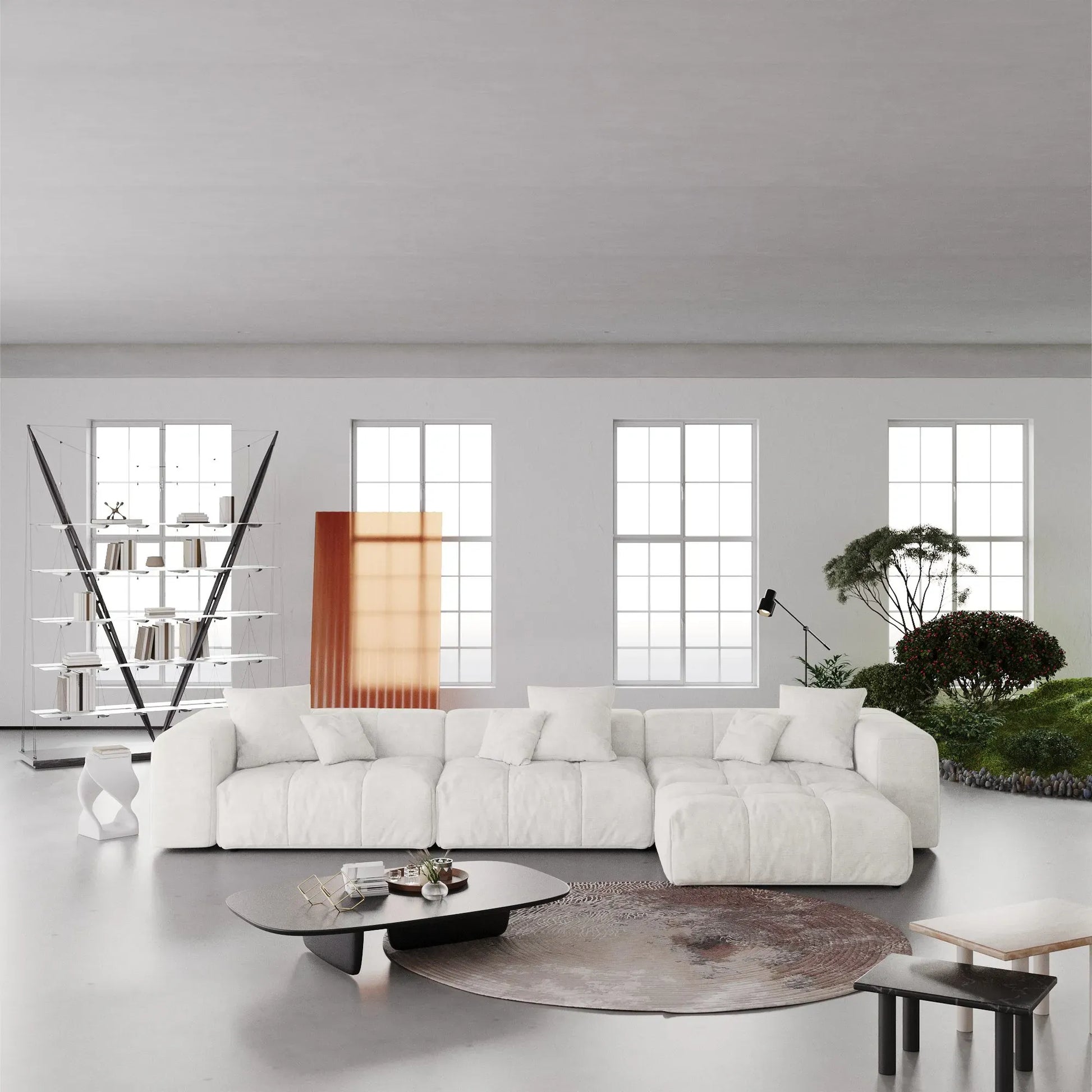 Modern living room with a white L-shaped sectional sofa, coffee table, and decorative elements.
