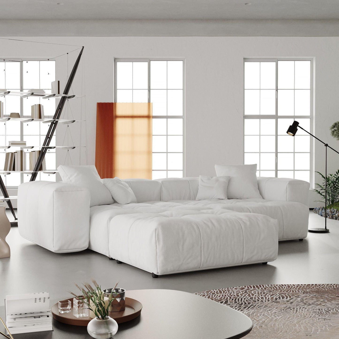 A modern linen modular loveseat with ottoman in a bright room, featuring a white color scheme and minimalistic design.