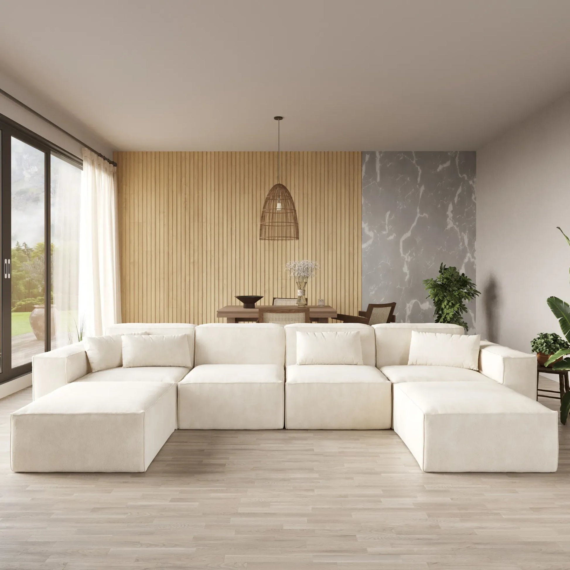 Modern living room with a white sectional sofa, wooden floor, and decorative elements.