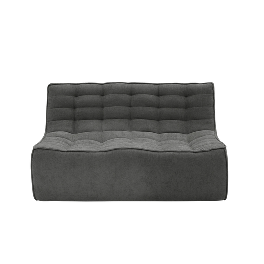 Gray tufted sofa on a white background