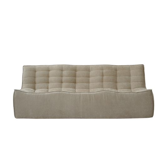 Beige tufted floor waffle sofa on a white background