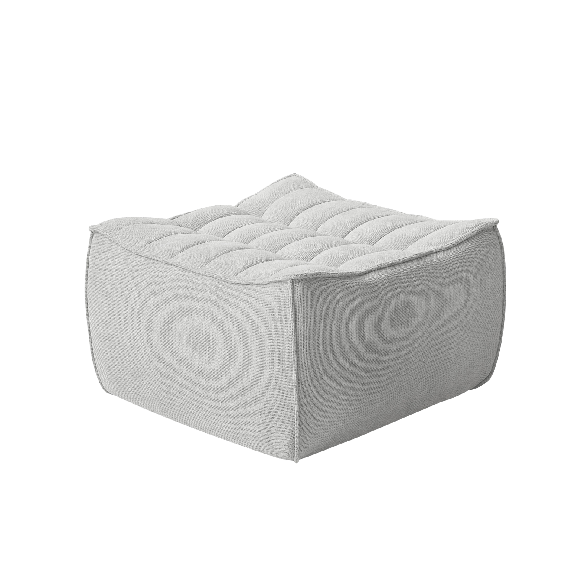 Light gray ottoman with tufted design on a white background