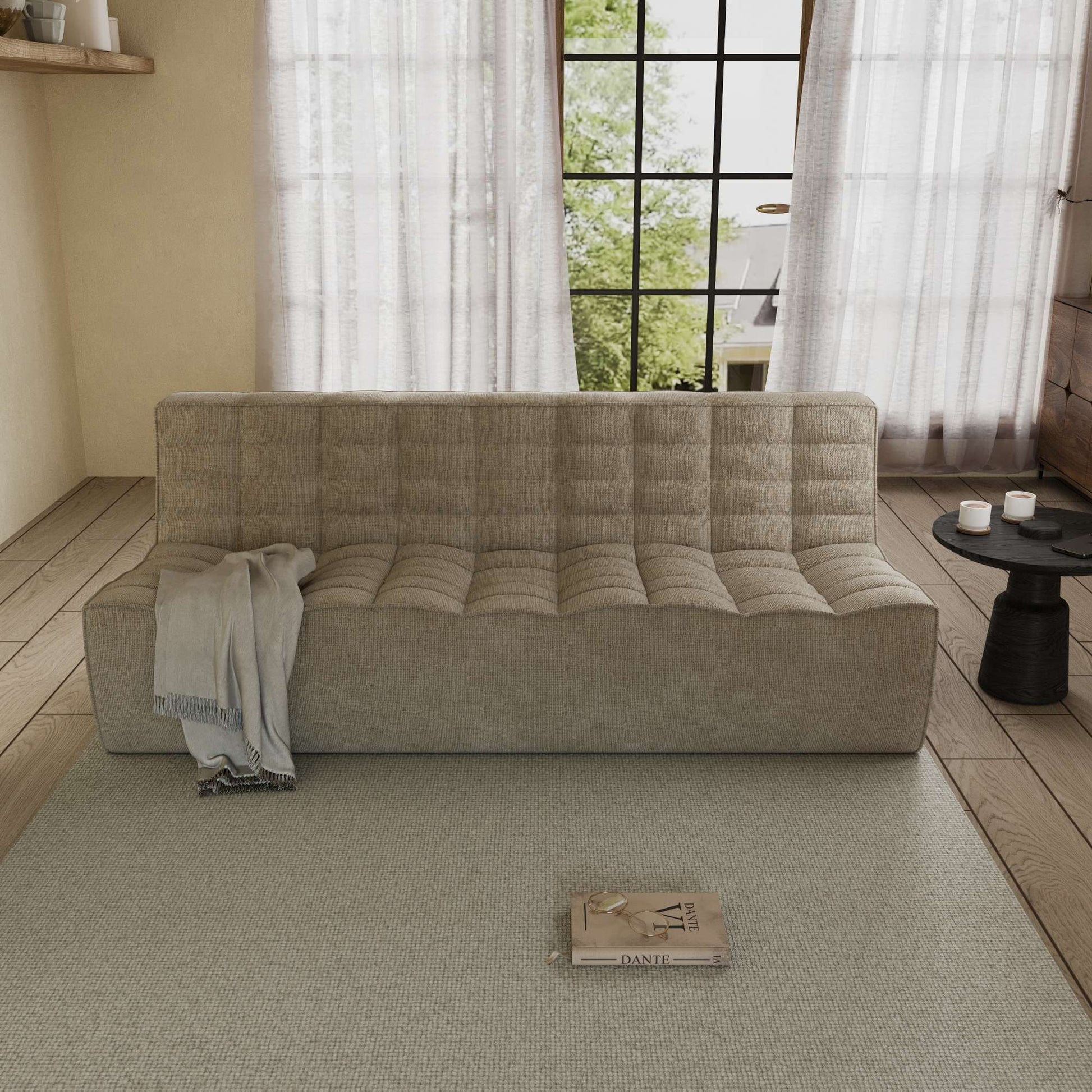 A khaki chenille 3-seater floor sofa with a minimalist design, placed in a room with a window, curtains, and a small round table with an object on it.