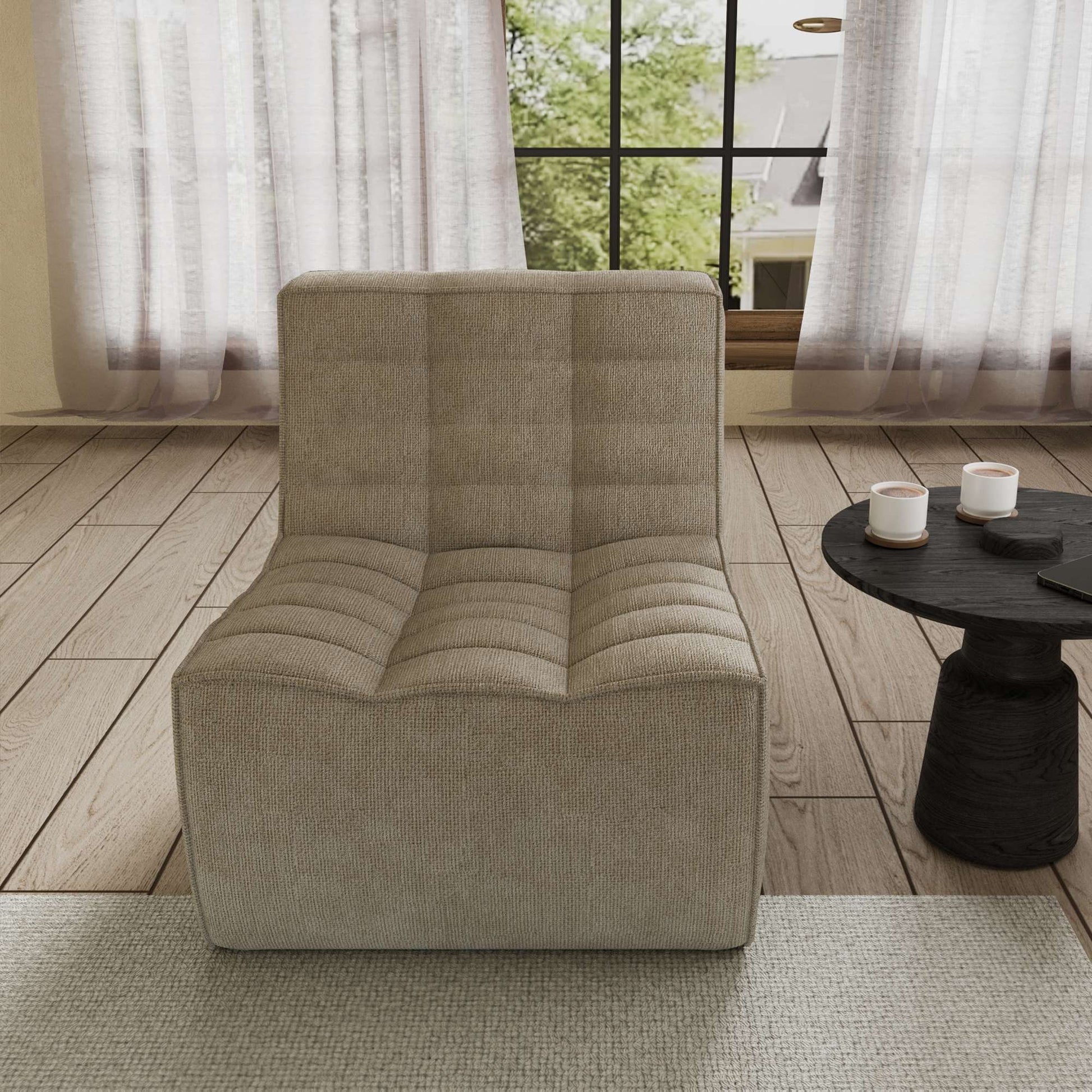 A khaki chenille accent chair with a minimalist design, positioned in a room with a window, curtains, and a small round side table.