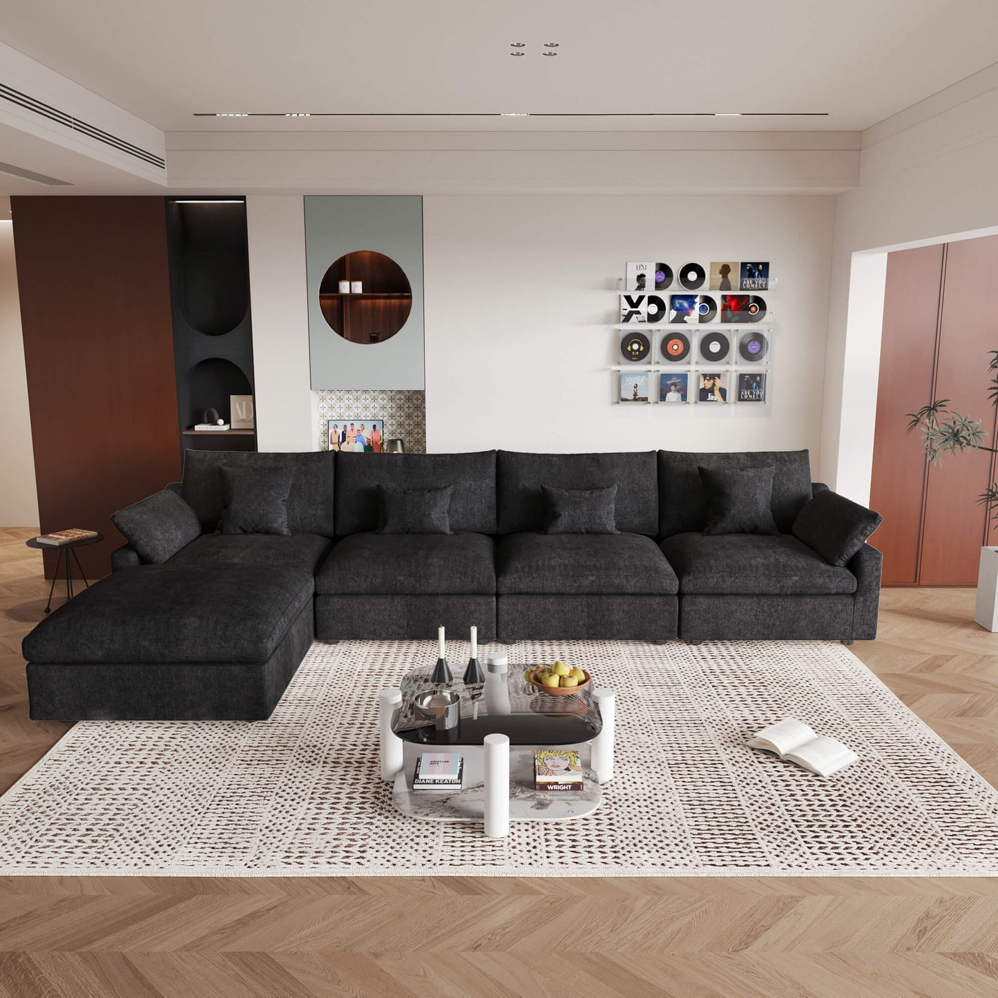 A large, black washable cloud sectional 5-seat sofa with removable cushions and an ottoman, placed in a living room setting.