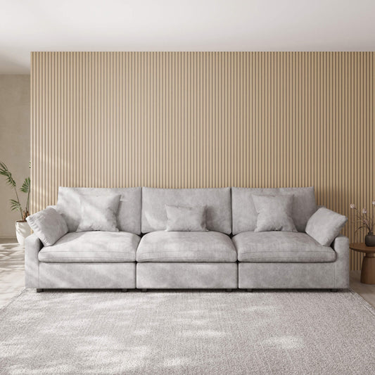 Light gray 3-seater sofa in a room with a striped wall and rug