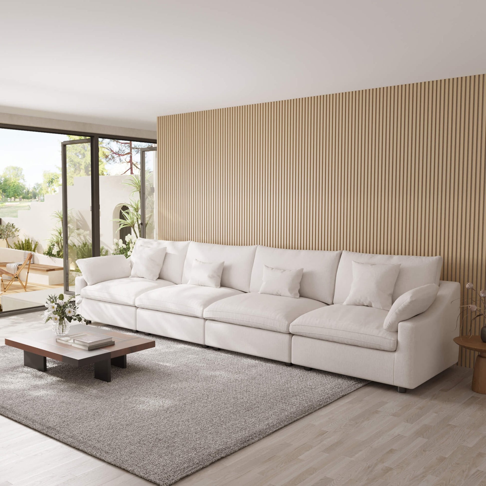 Modern living room with a white 4-seat sectional sofa, coffee table, and decorative elements.