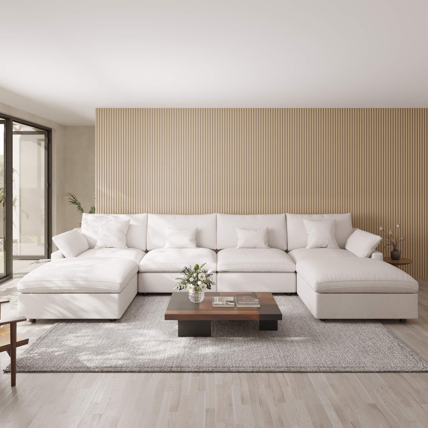 Modern living room with a white sectional sofa, wooden coffee table, and striped wall.
