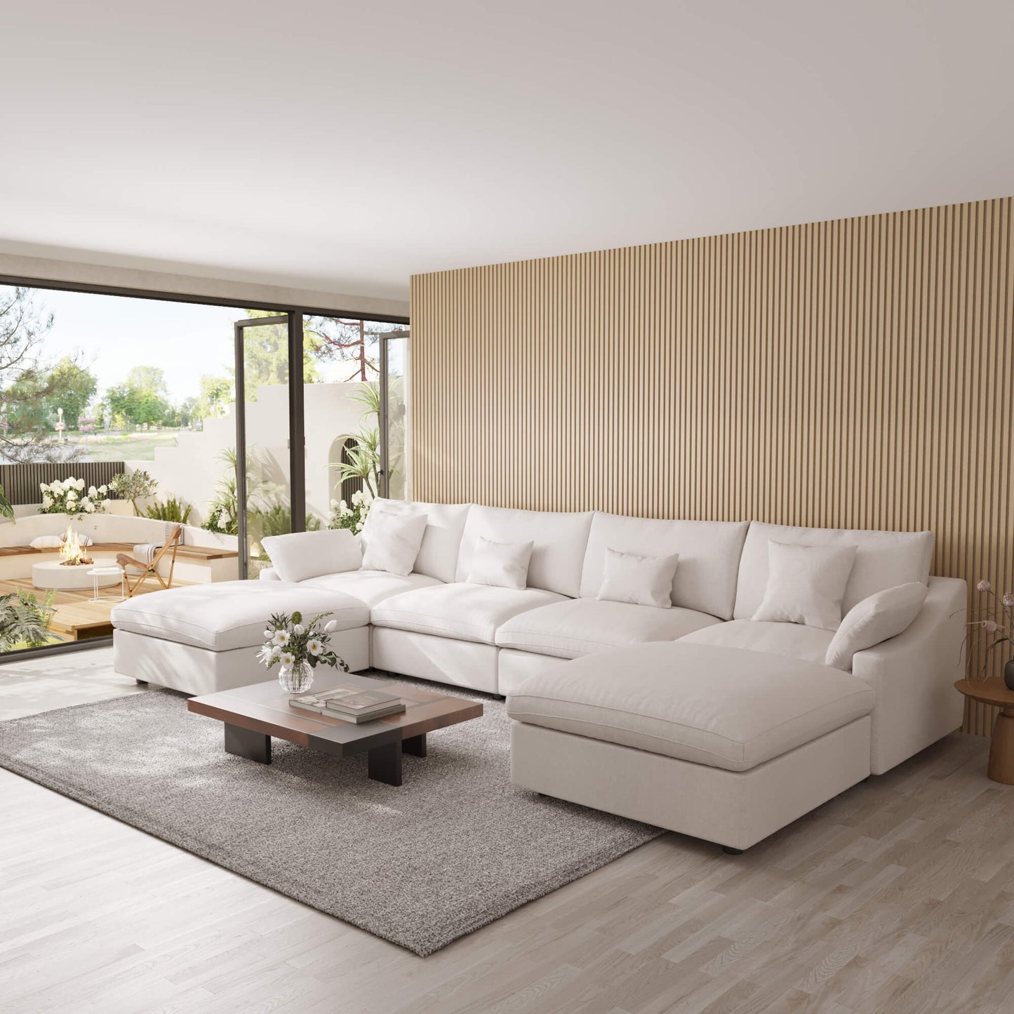 Modern living room with a white U-shaped sectional sofa, wooden coffee table, and decorative elements.