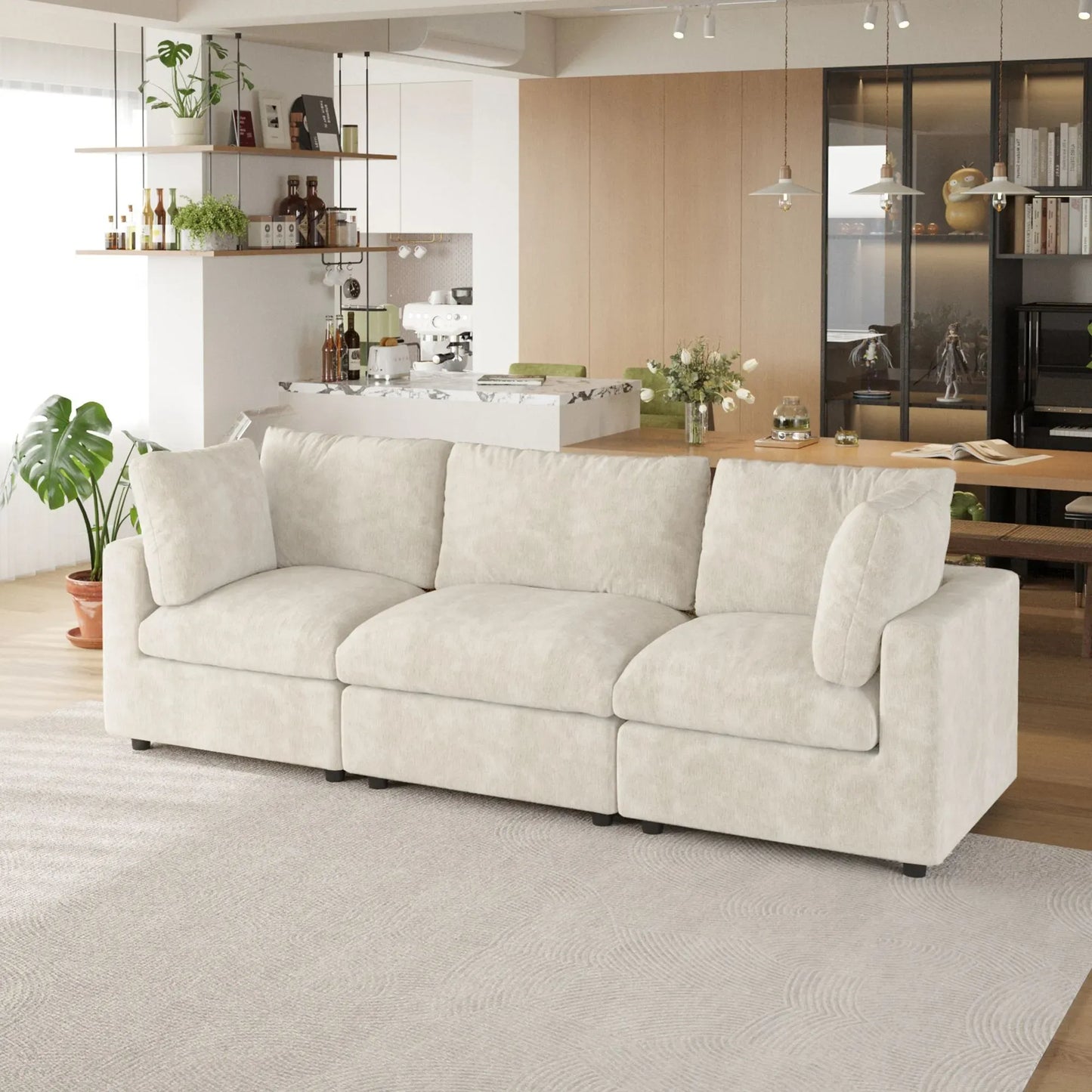 Beige 3-seater sofa in a modern living room with a kitchen in the background