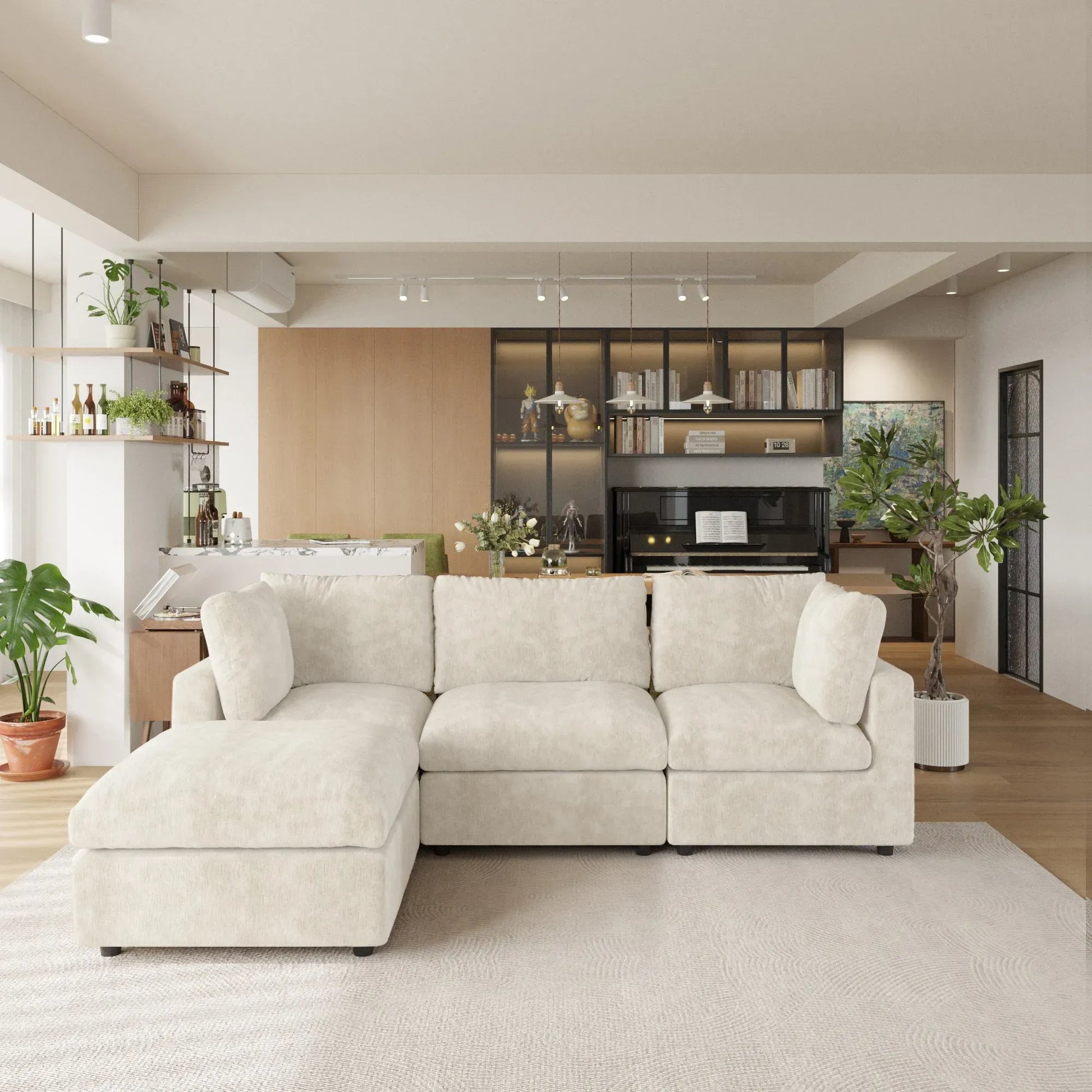 Beige L-shaped 4-seater sectional sofa in a modern living room with kitchen in the background