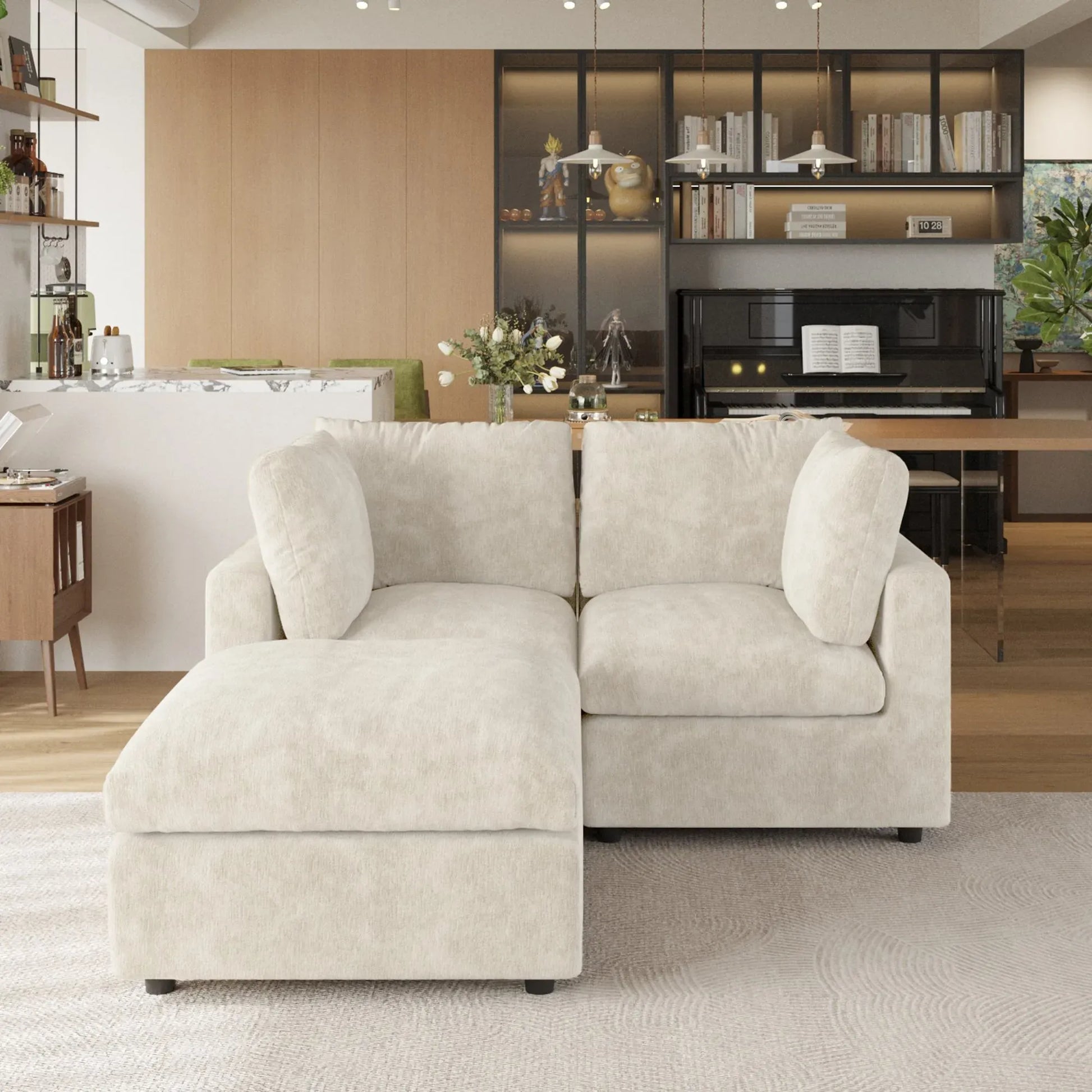 Beige sectional sofa in a living room with a piano and bookshelf in the background.