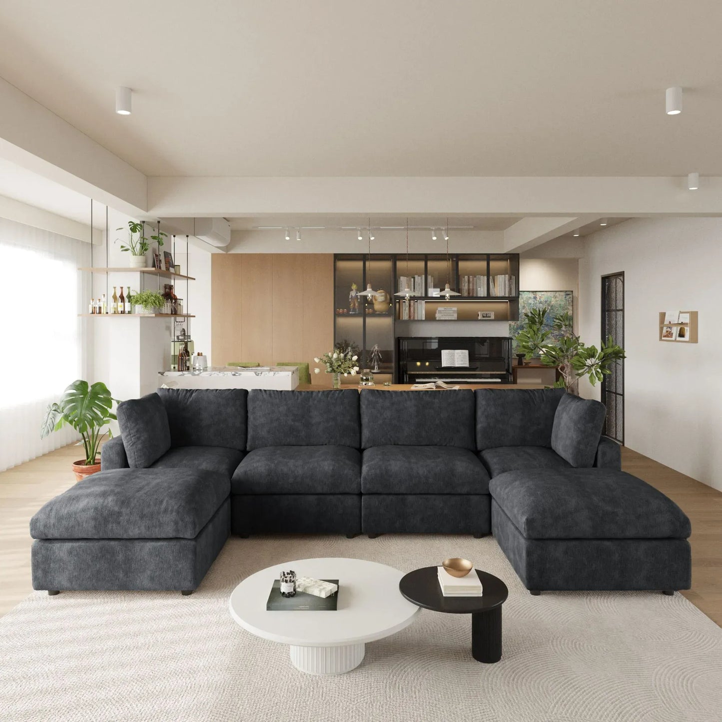 Modern living room with a black U-shaped 6-seater sectional sofa and coffee tables.