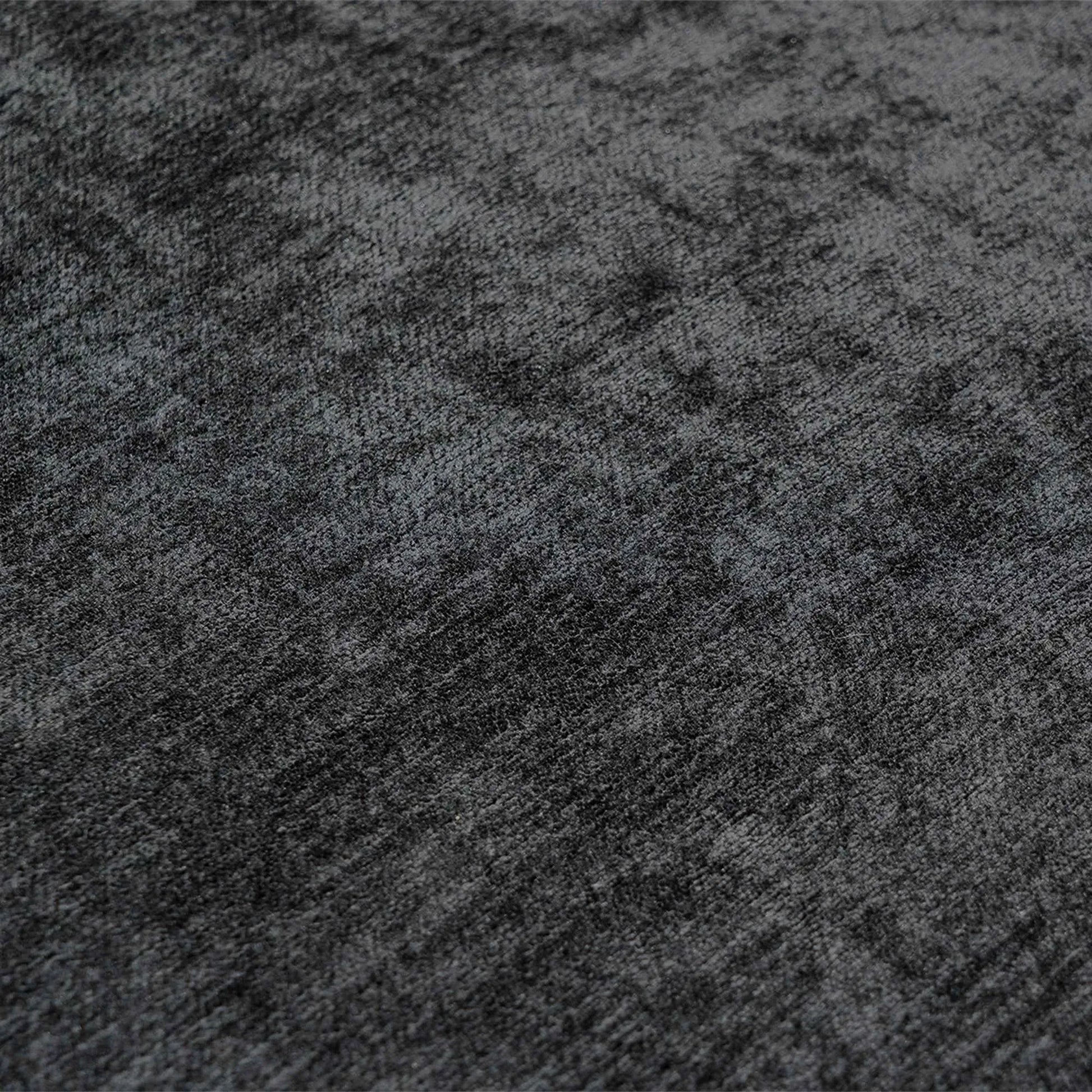 Close-up of a textured black fabric surface
