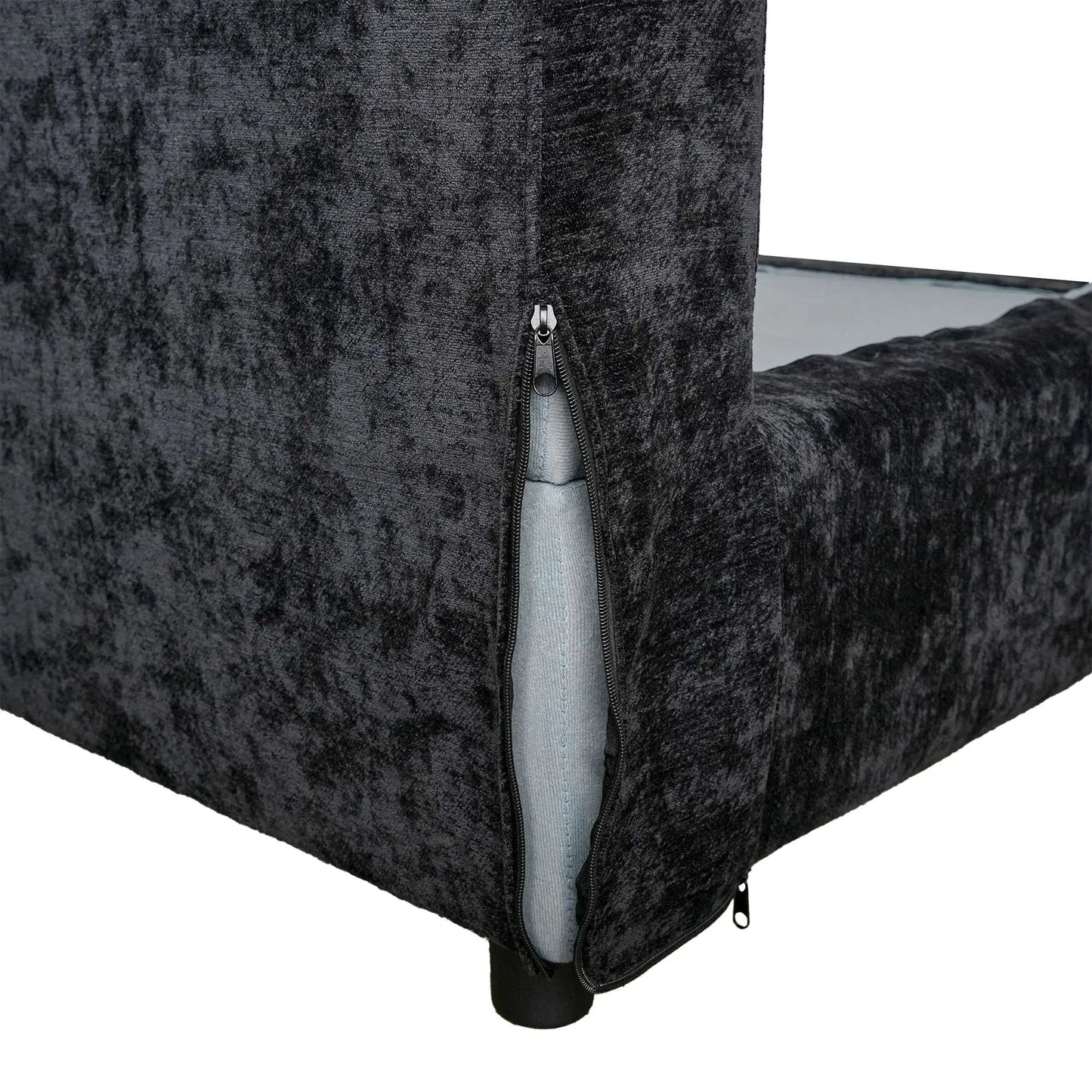 Black textured couch with a visible zipper on a white background
