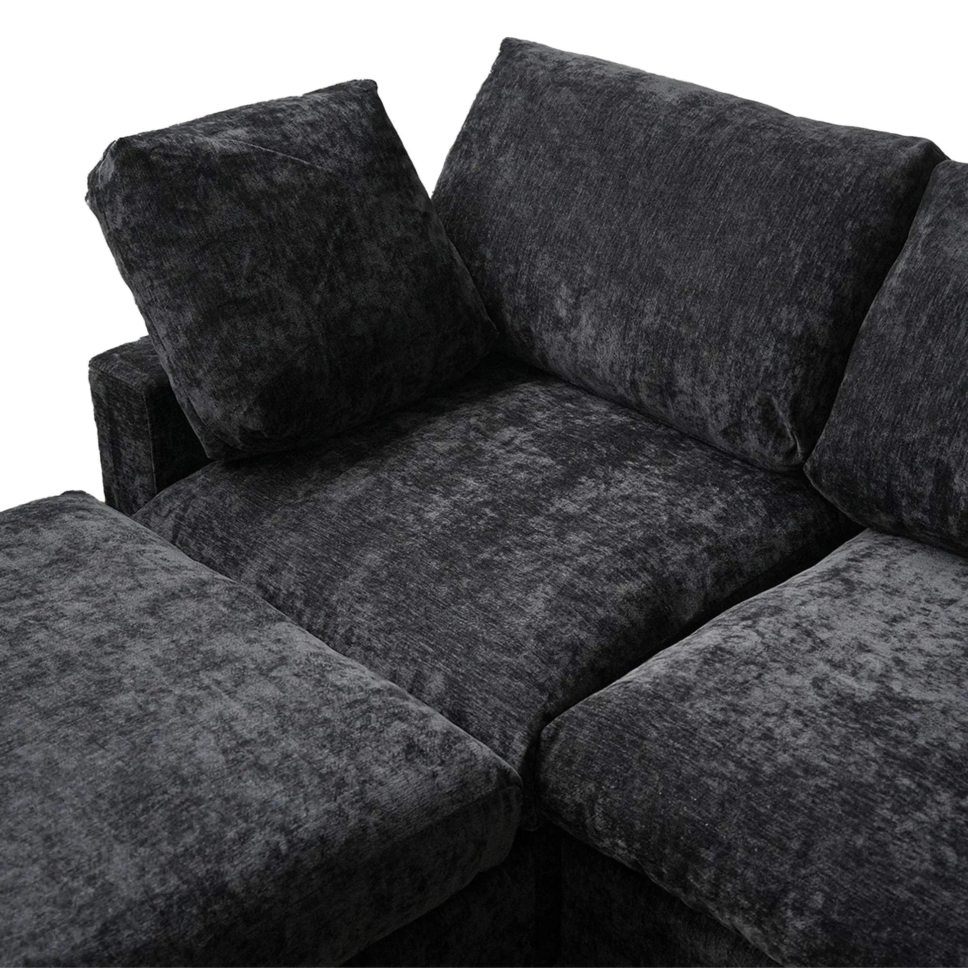 Black textured sectional sofa on a white background