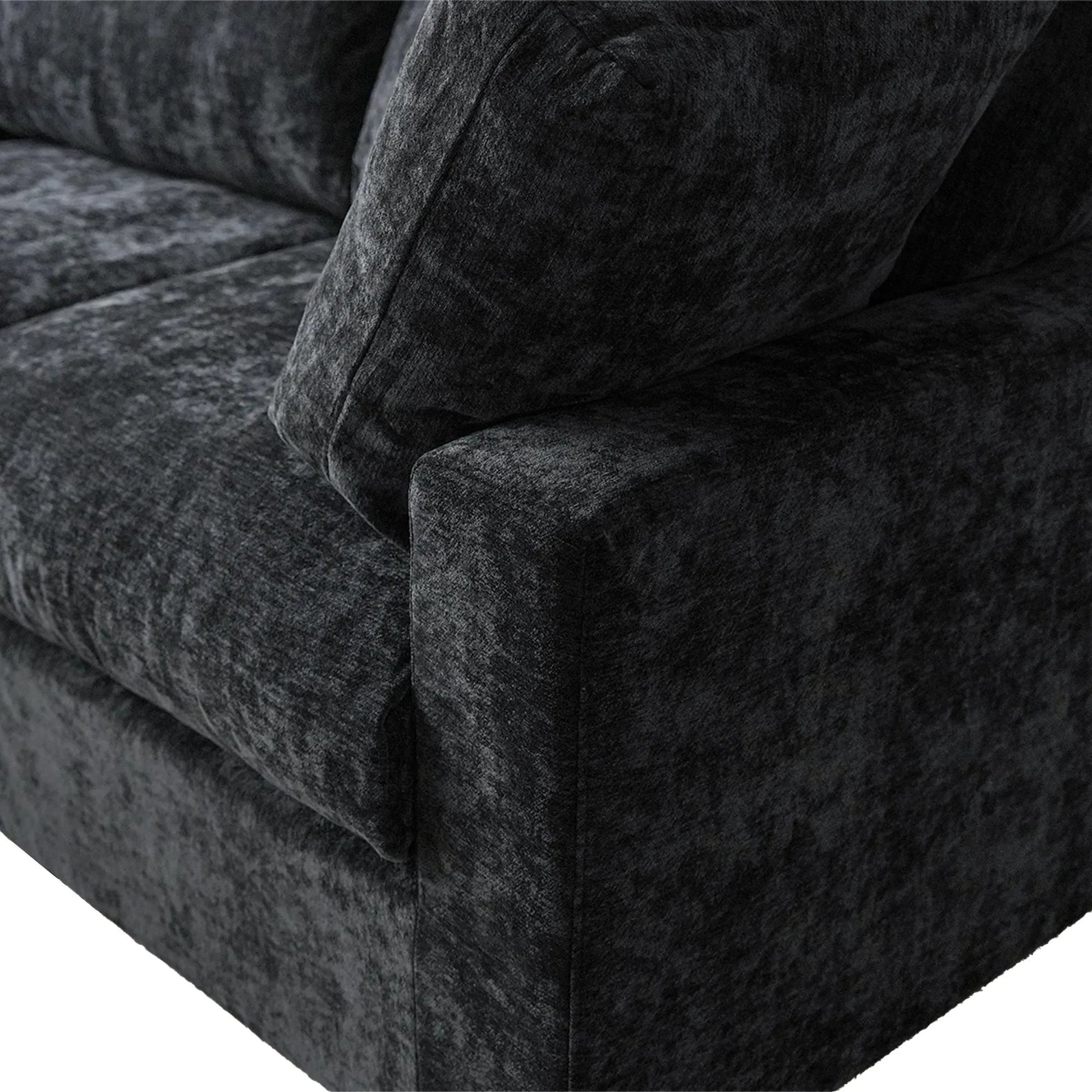 Close-up of a black textured sofa corner