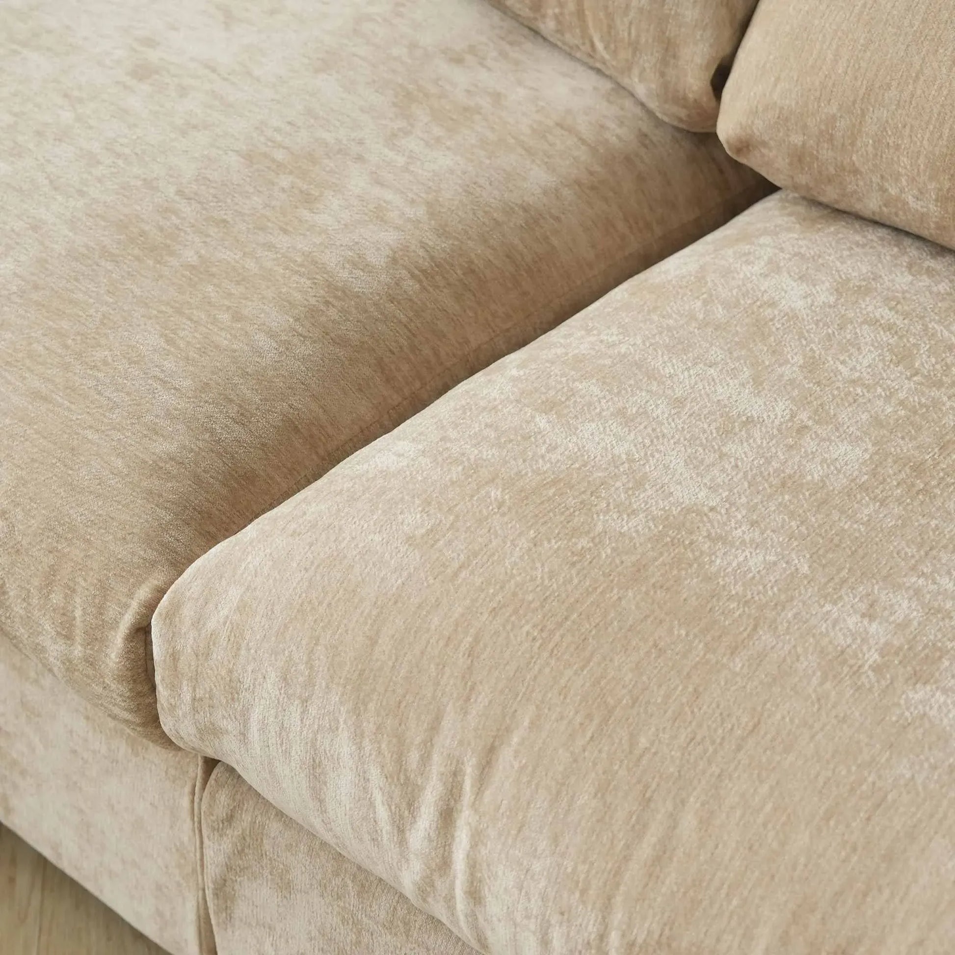 Close-up of a khaki sofa with textured fabric