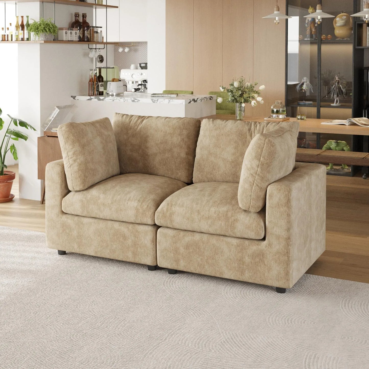 Khaki sofa in a living room with a kitchen in the background