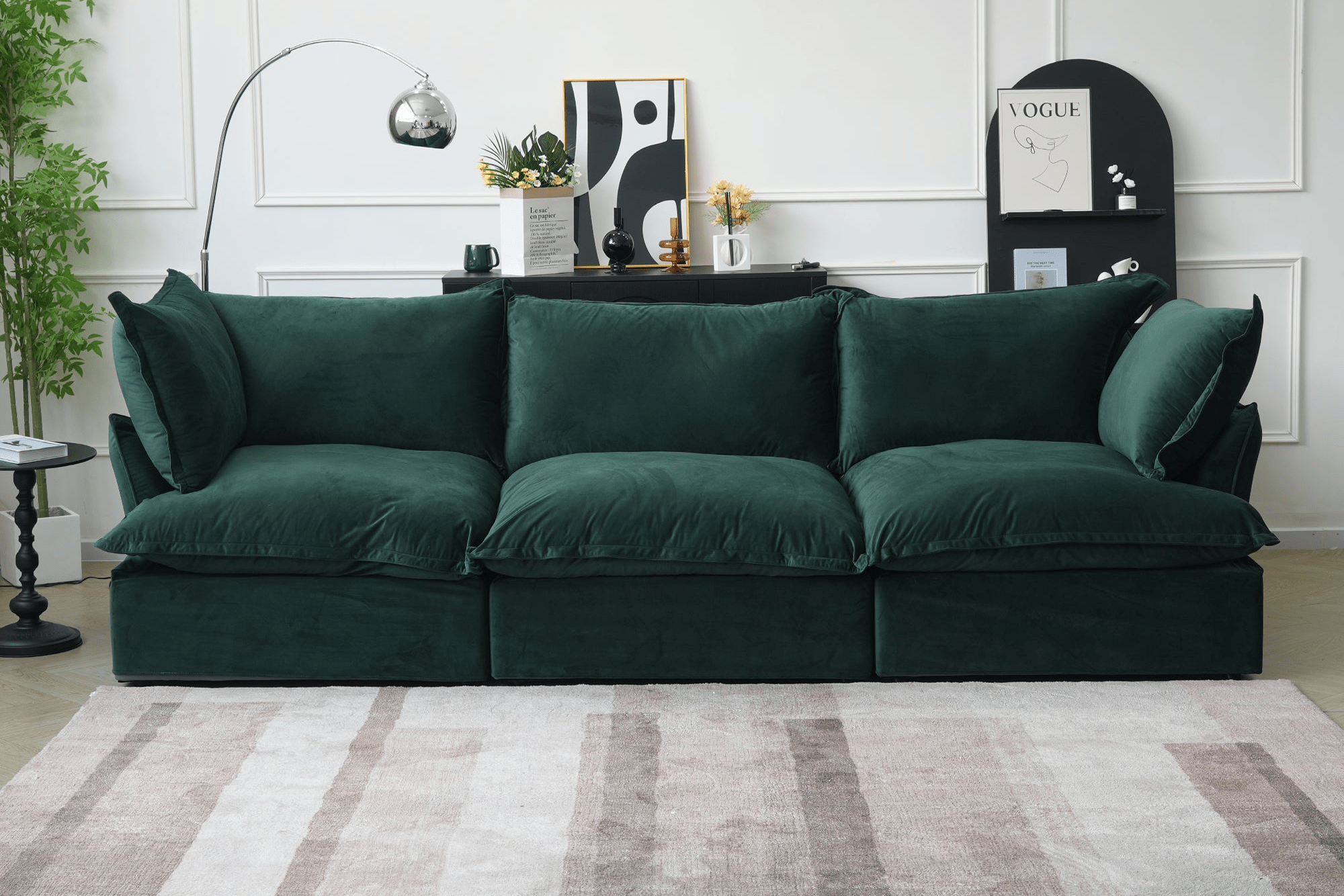 Green velvet 3-seater sofa featuring washable covers in a modern living room