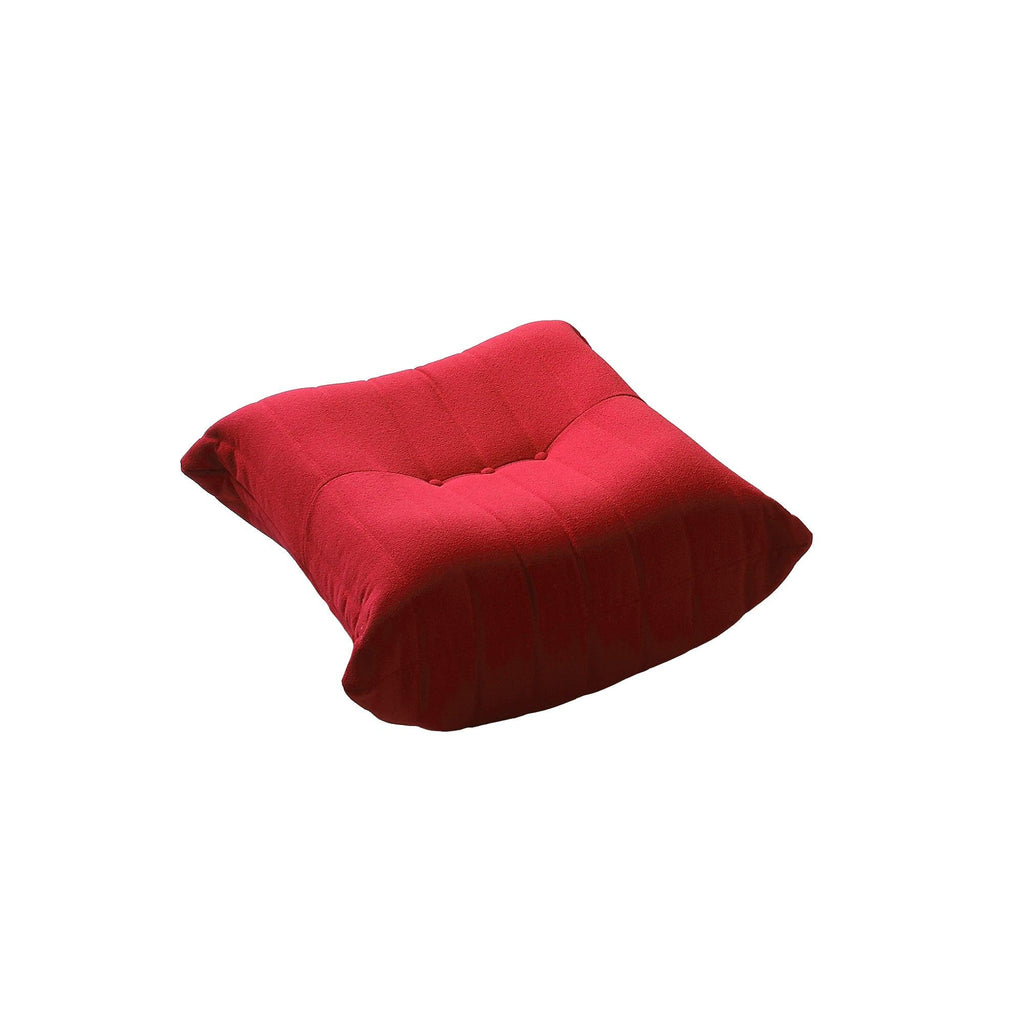 A distinctive caterpillar-shaped red upholstered ottoman with a soft, plush appearance.