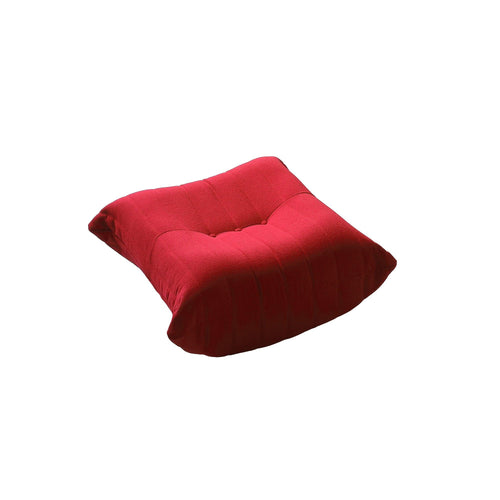 A distinctive caterpillar-shaped red upholstered ottoman with a soft, plush appearance.