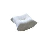 A distinctive caterpillar-shaped white upholstered ottoman with a soft, plush appearance.