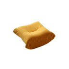 A distinctive caterpillar-shaped yellow upholstered ottoman with a soft, plush appearance.