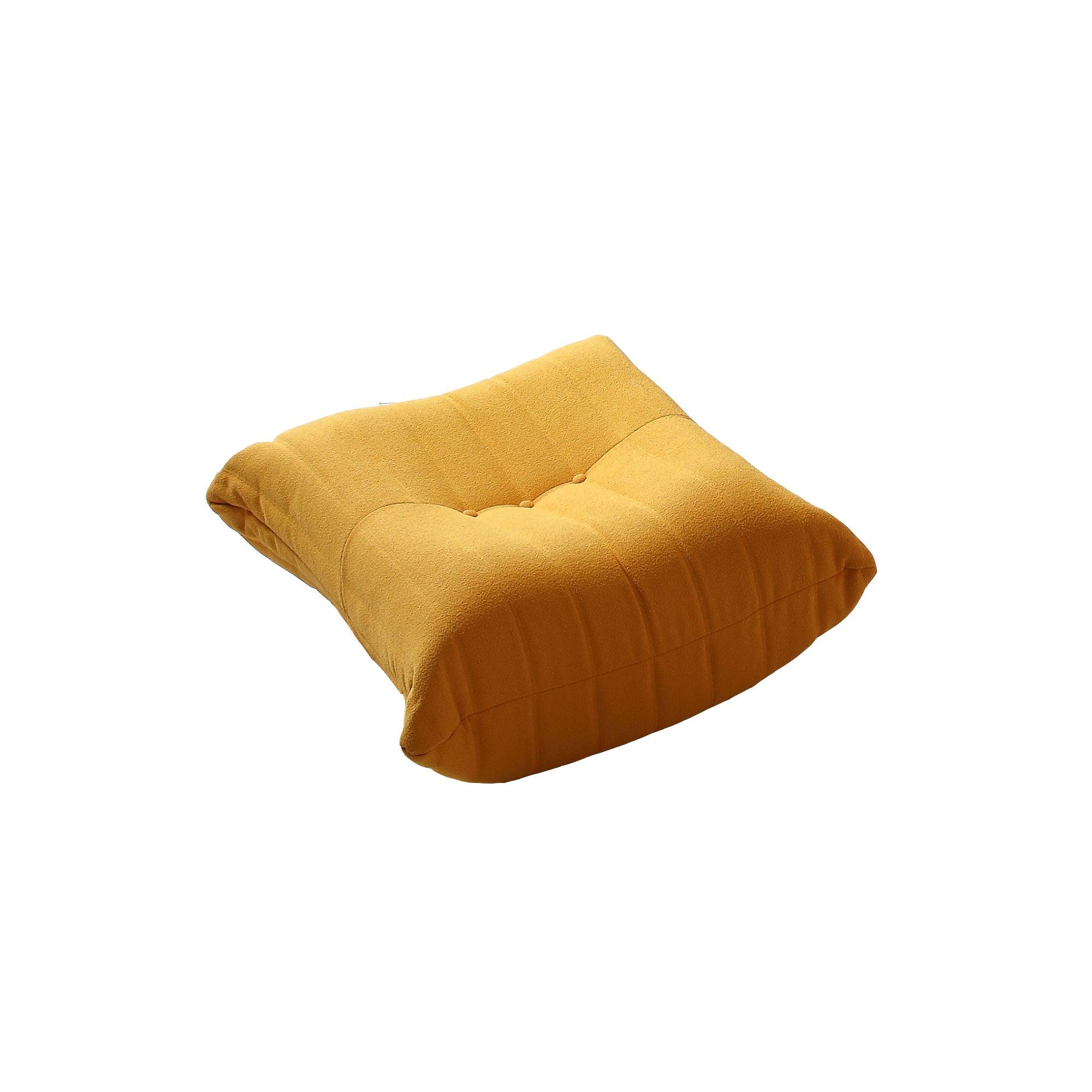 A distinctive caterpillar-shaped yellow upholstered ottoman with a soft, plush appearance.