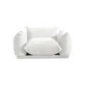 Beige chenille overstuffed armchair, retro design.