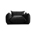 Black chenille armchair, overstuffed design, retro style.