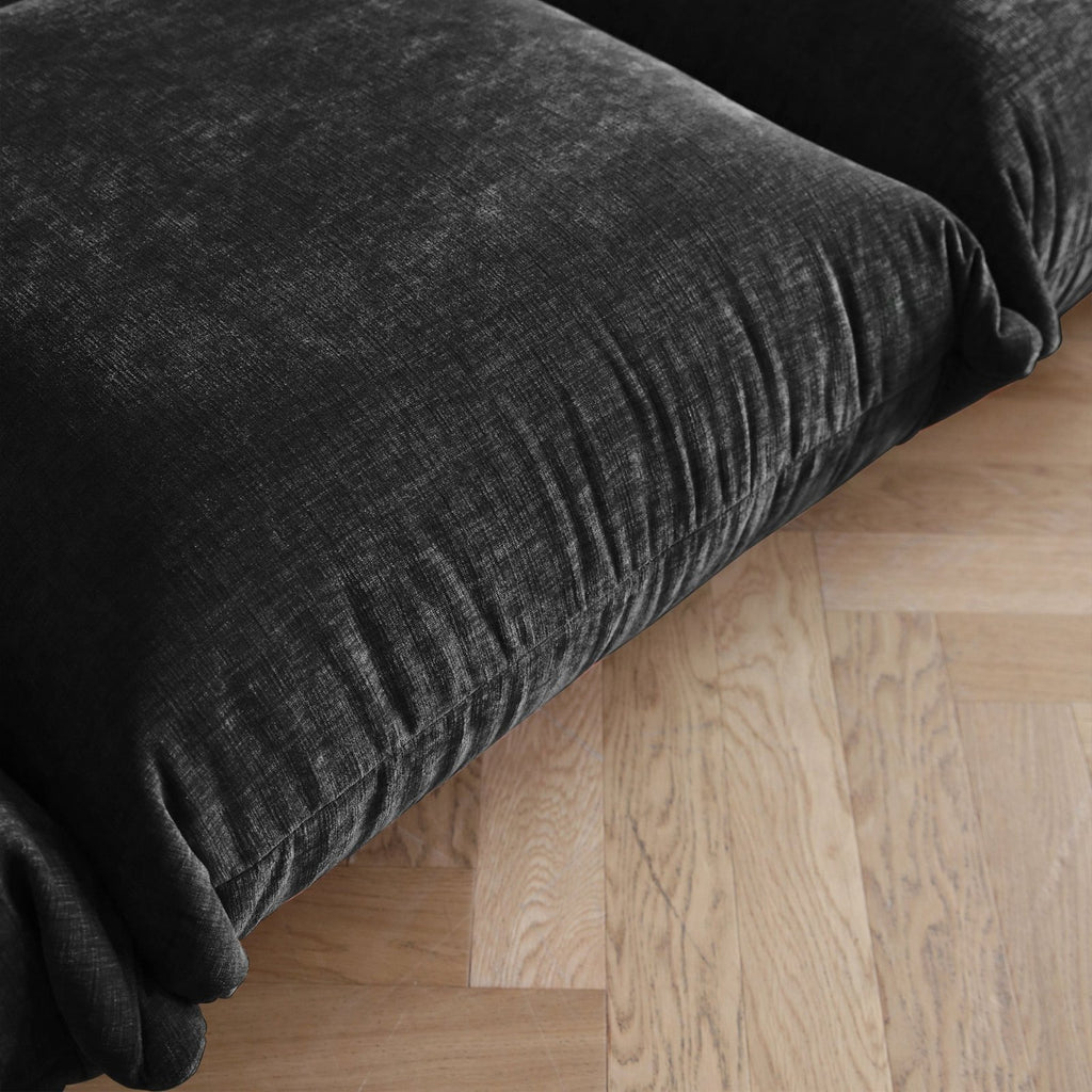 Black overstuffed chenille armchair seat detail