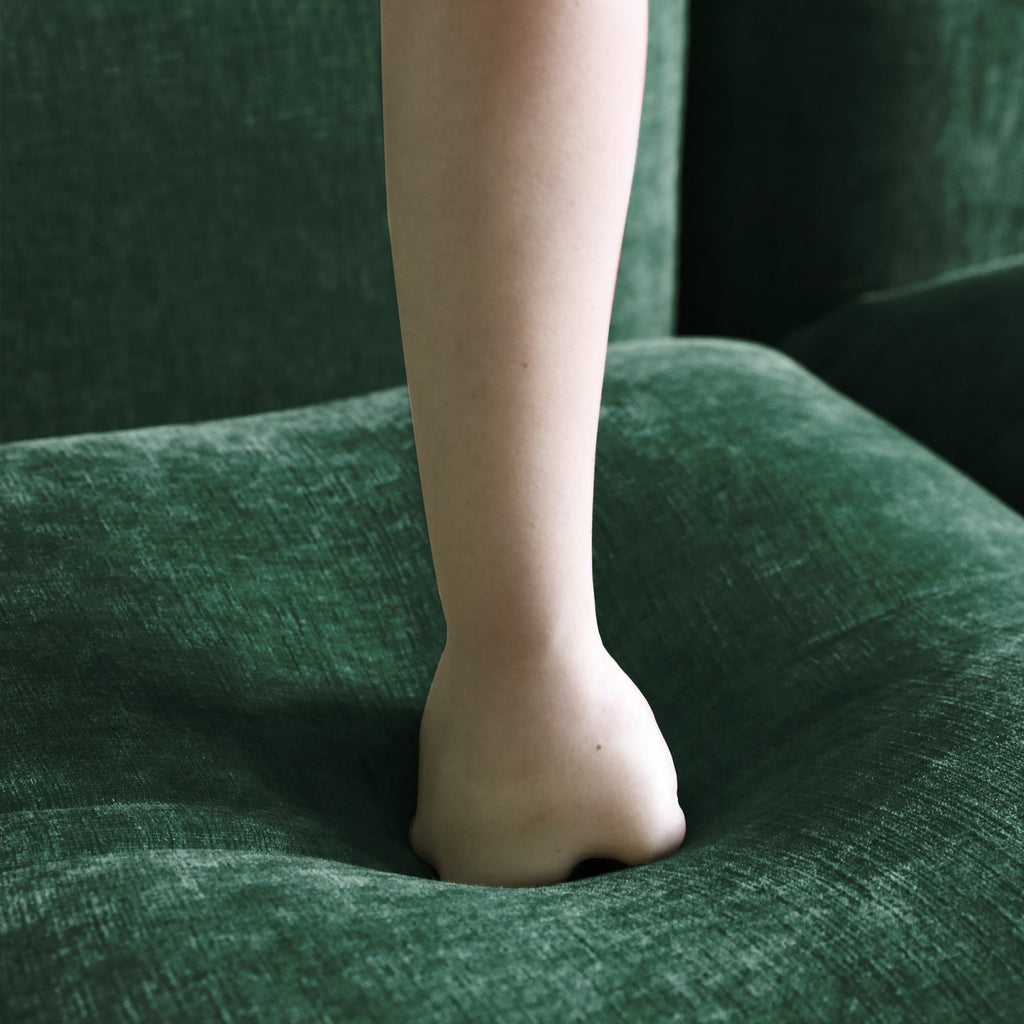 Emerald green chenille overstuffed sofa foam density detail.