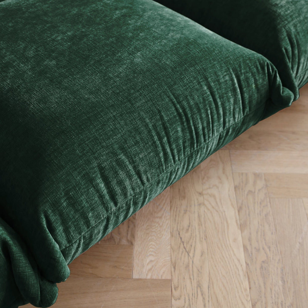 Emerald green chenille overstuffed sofa seat detail.