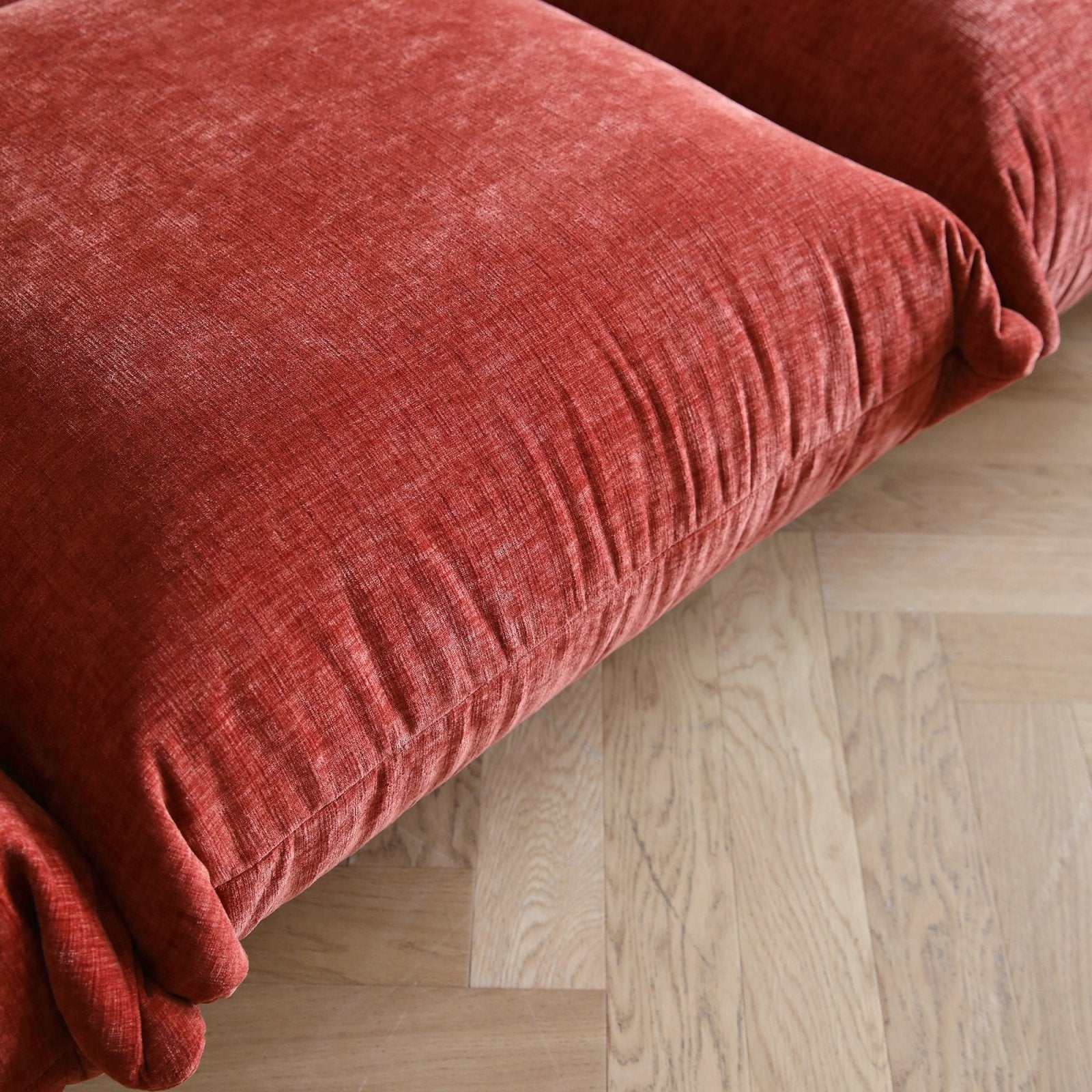 Blood orange overstuffed chenille armchair seat detail