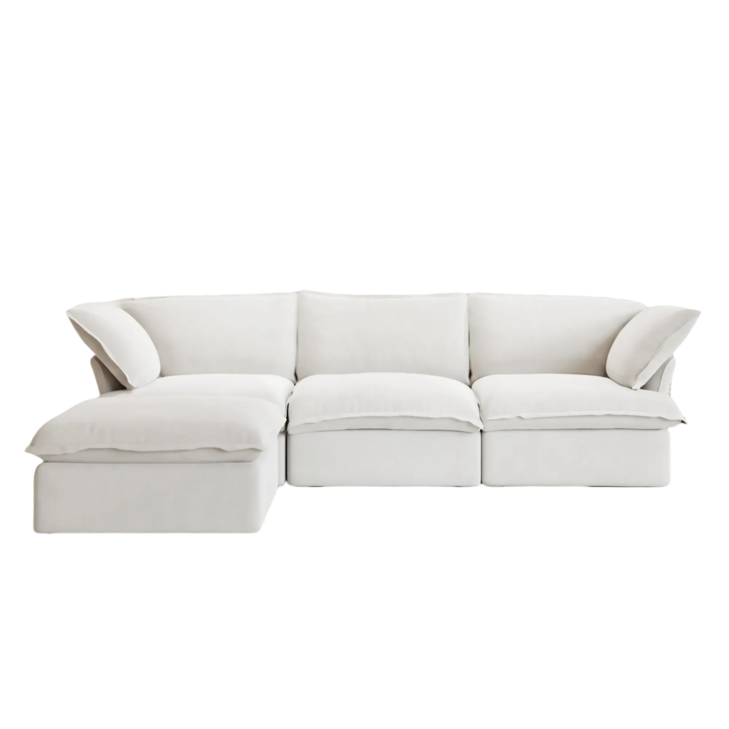 White sectional L-shaped 4-seater sofa on a white background