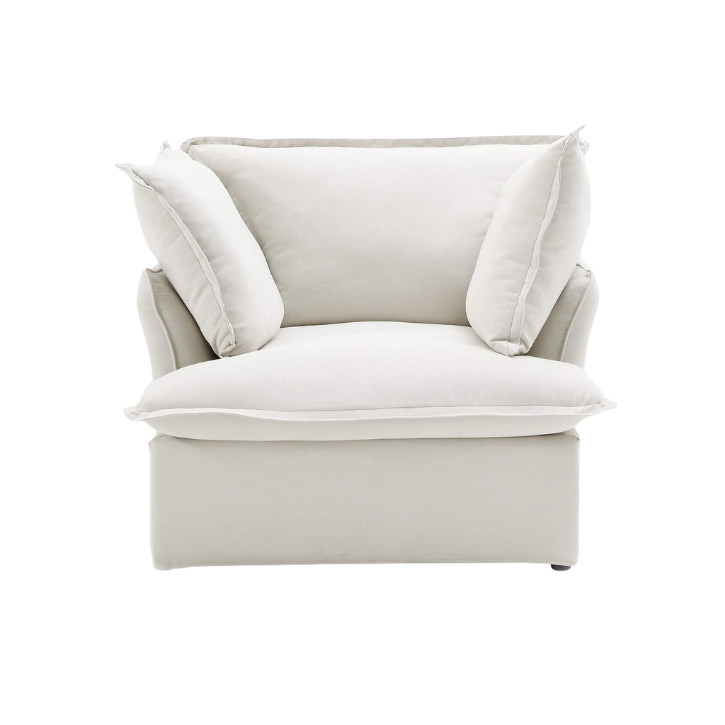 White armchair with cushions on a white background