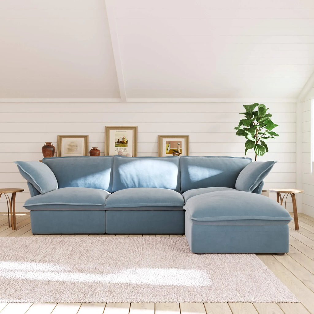 Baby blue 3-seat L-shape sectional with washable covers and storage ottoman.